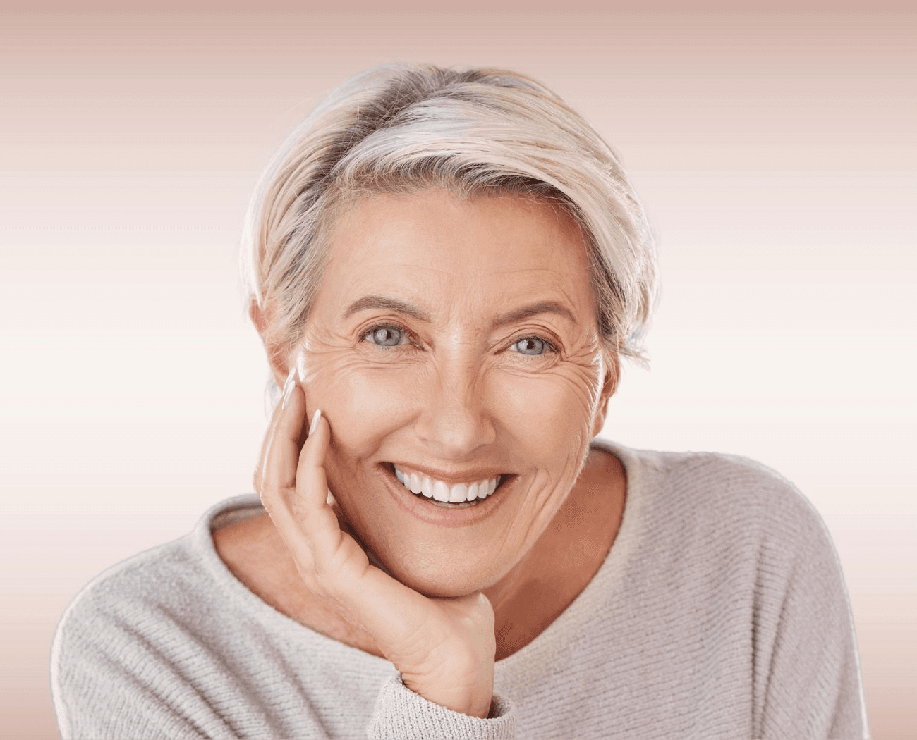 Elegant older woman smiling confidently with beautiful dentures at Esthetique Dentistry Ashburn