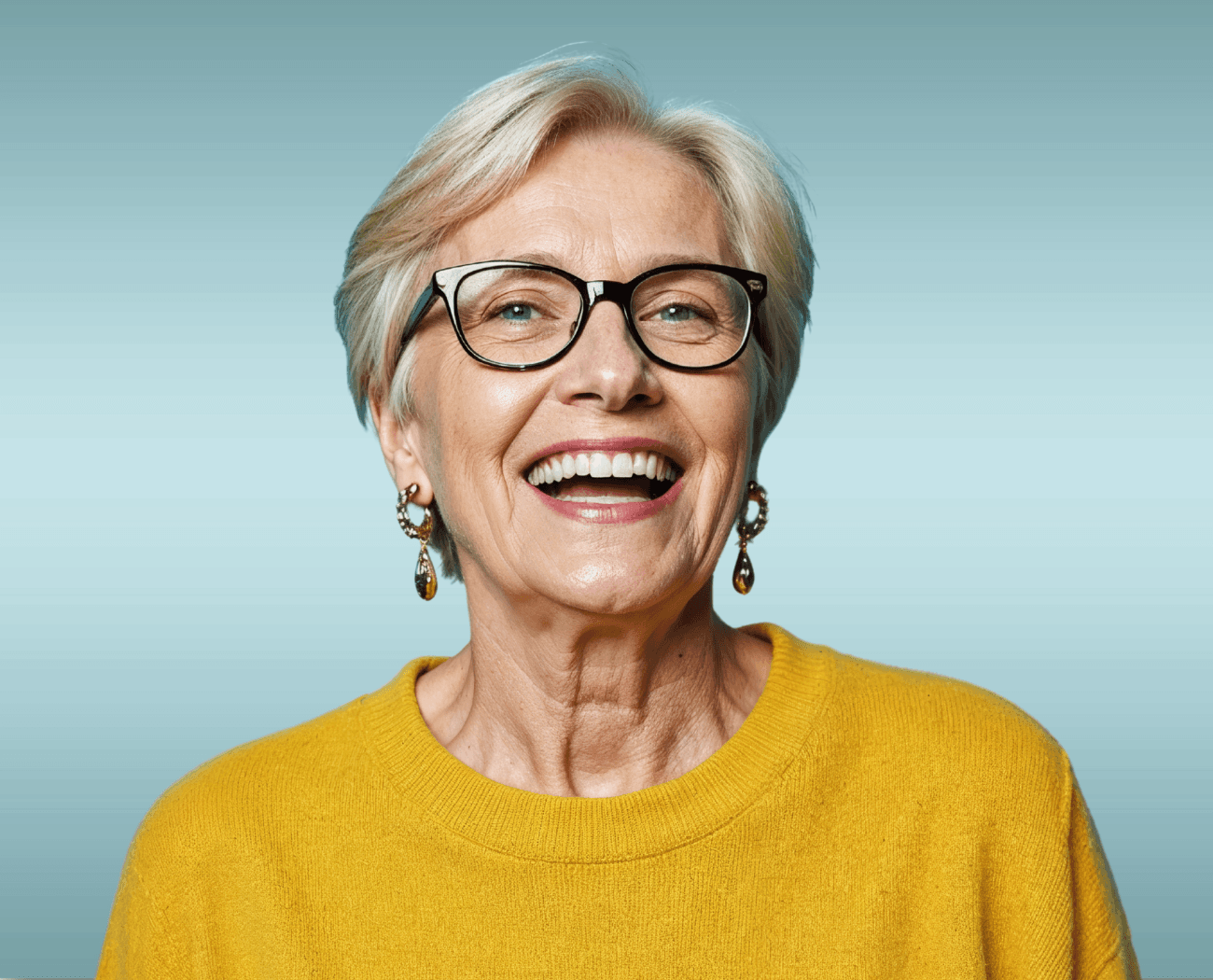Mature woman with glasses laughing confidently after prosthodontic treatment at Esthetique Dentistry Ashburn